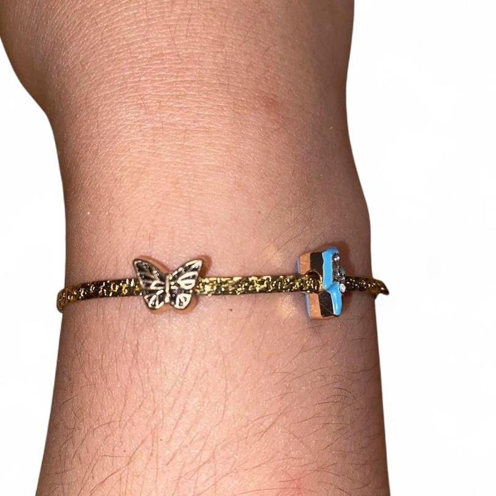 Gold plated 14kgpButterfly Bracelet with Blue lightning bolt